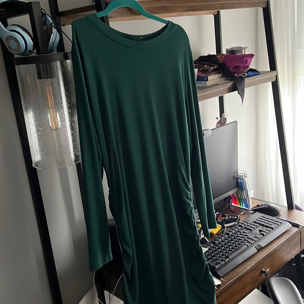 Beautiful formfitting, forest green dress with ties at the side